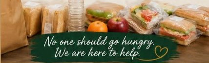 Bagged sandwiches, bread, fruit, and water ready to share, from our flyer